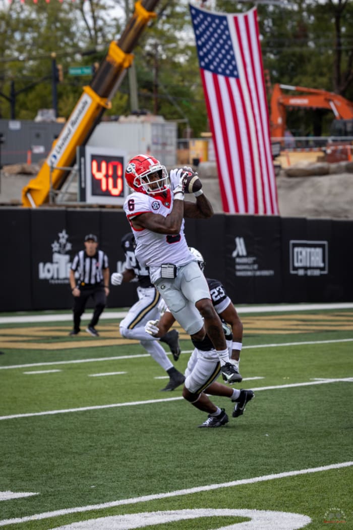 WR, Dominic Lovett catches a back shoulder ball from QB, Carson Beck.